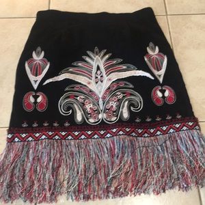 Faux suede skirt with front embroidery.